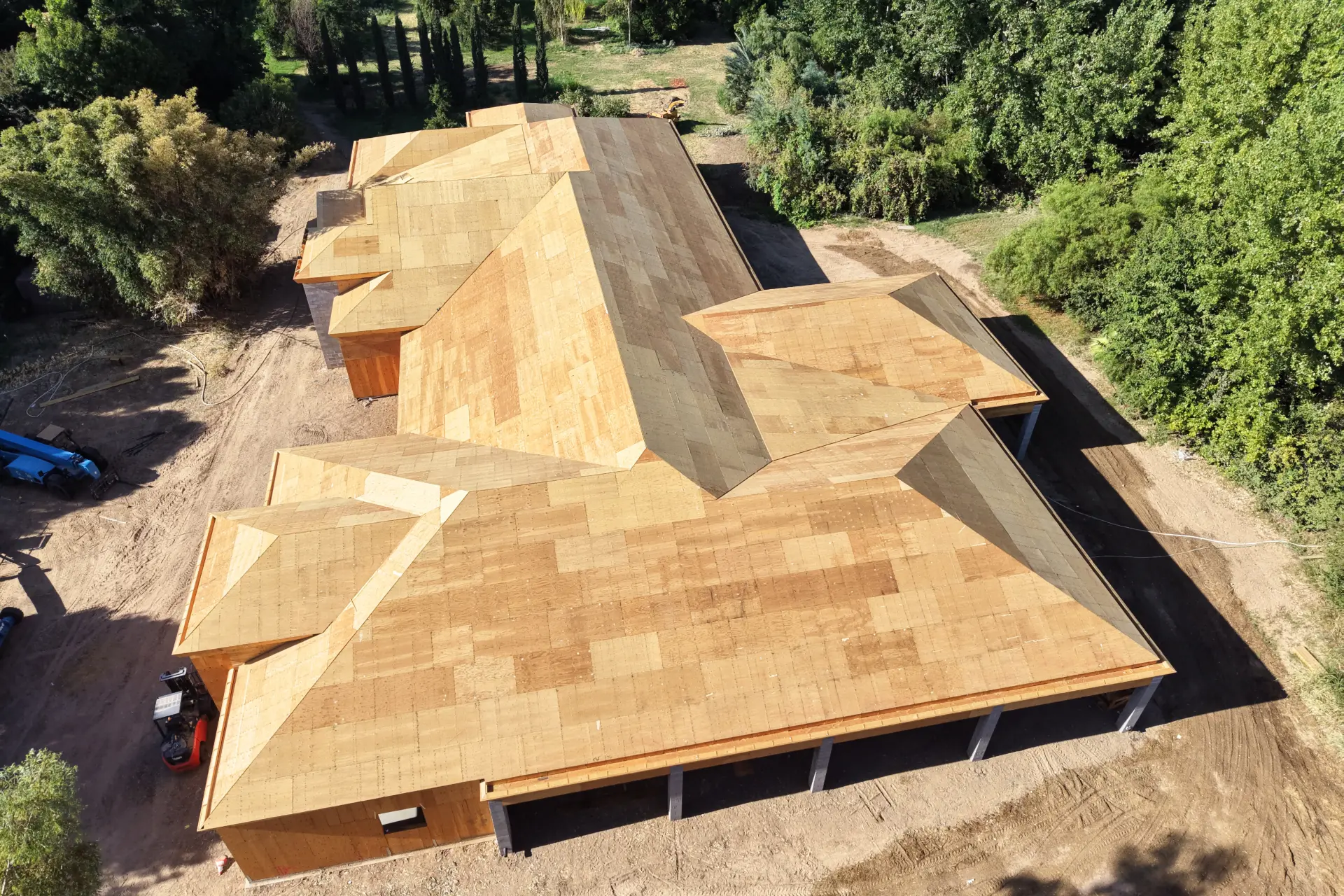 Completed plywood roof decking on a large custom residence