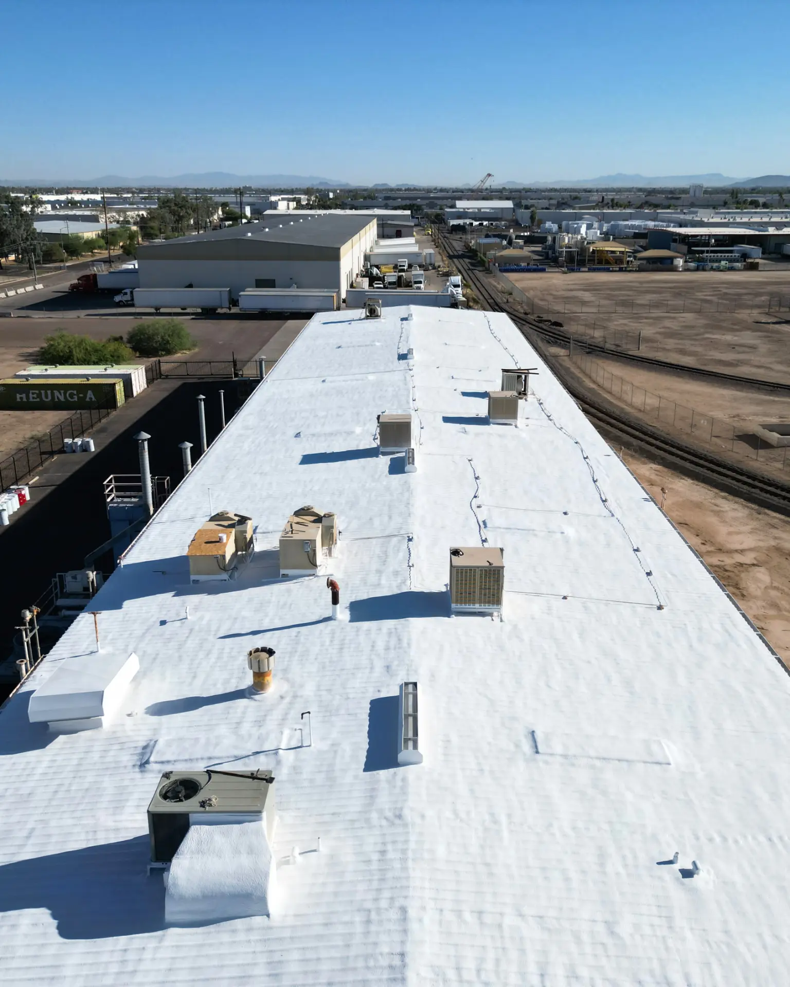Foam roof with fresh white coating on a Phoenix industrial building