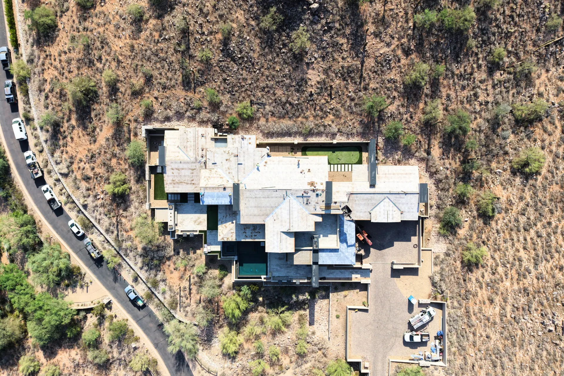 Top down aerial of a hillside home mid re-roof