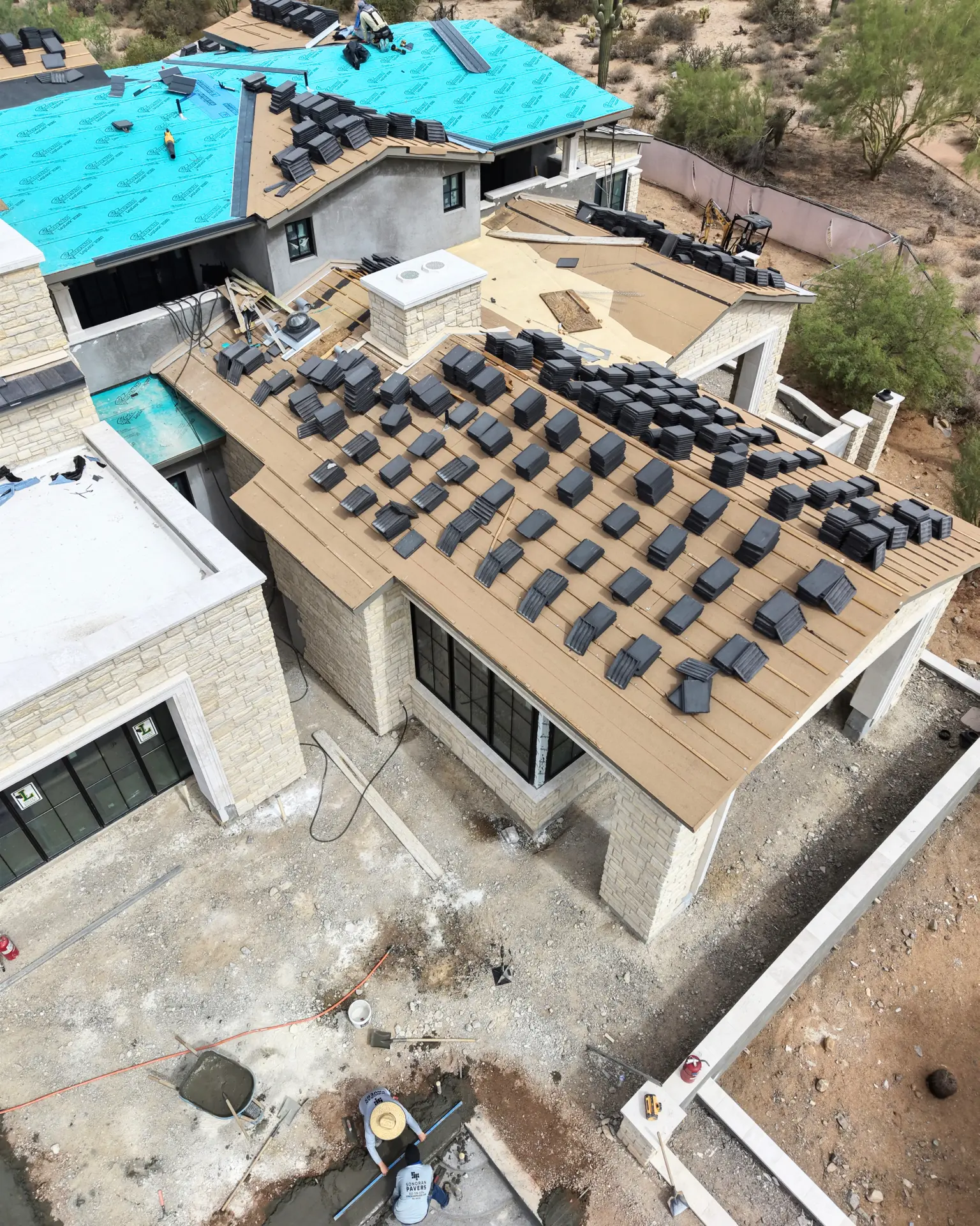 Concrete tile load out on a luxury new construction roof