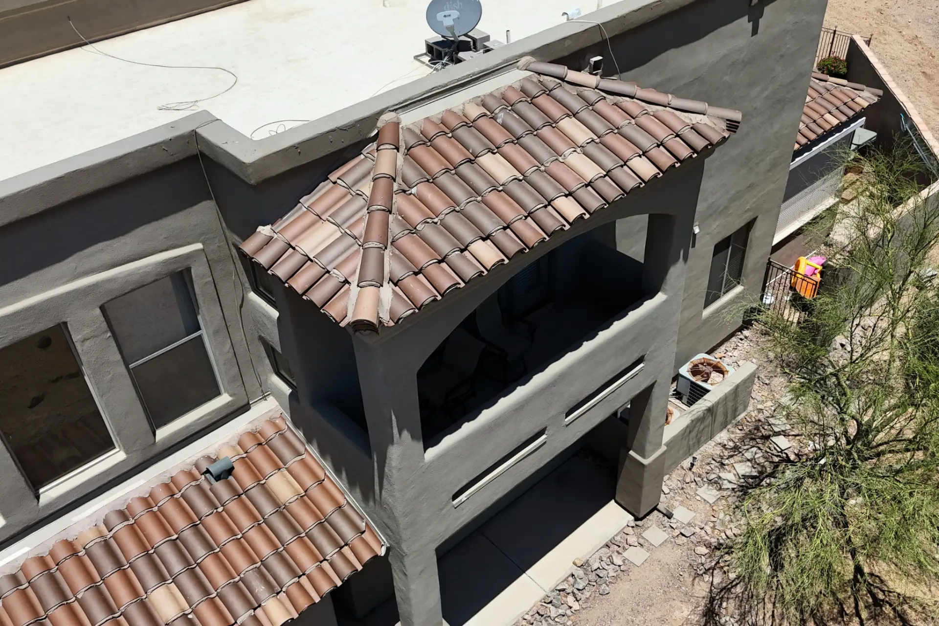 Close up of clay barrel tile roofing on a residential balcony