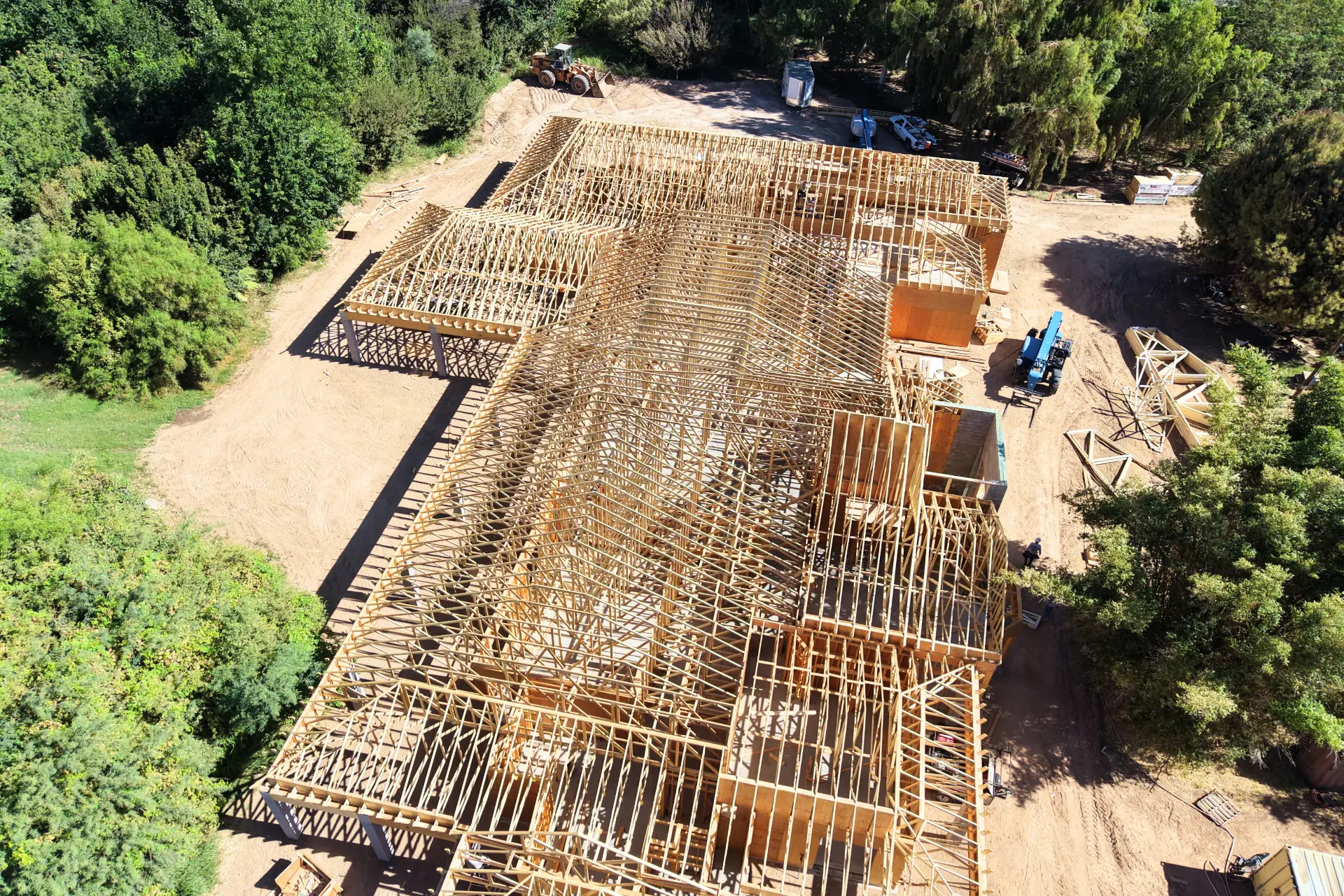 Aerial of trusses installed across a large residential frame